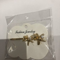 Pinza para cabello CAIMAN,con figuara metalica, modelos surtidos